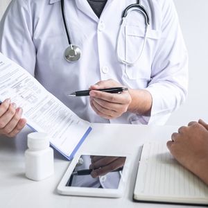 GP having a consultation with a long-term patient, representing continuity of care in Australian general practice